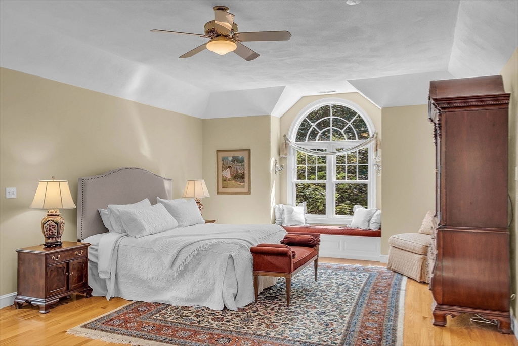 157 Lancaster Road North Andover, MA 01845 - Photo 24 of 42 a spacious bedroom with a bed and a couch