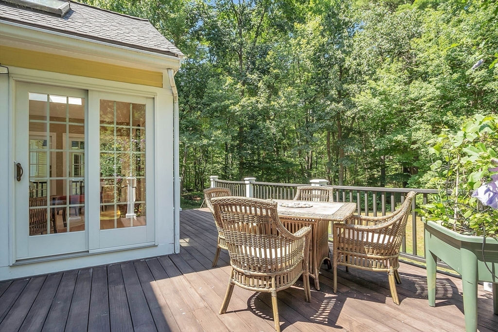 157 Lancaster Road North Andover, MA 01845 - Photo 38 of 42 a view of a chair and table on the deck