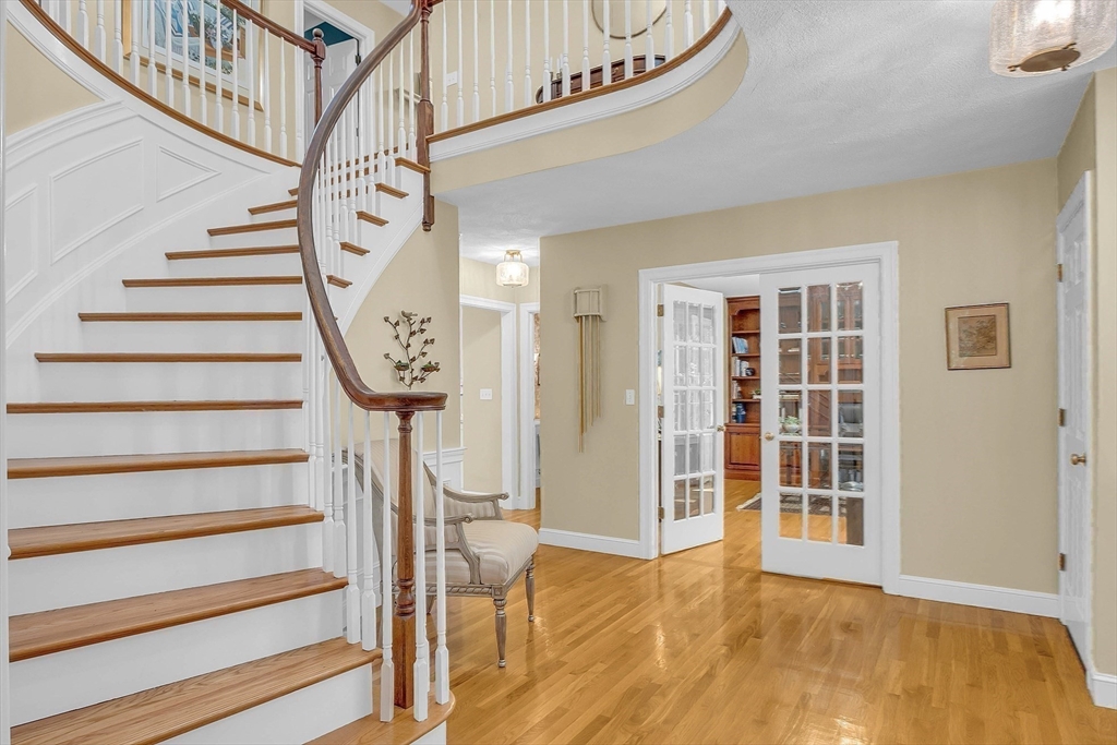 157 Lancaster Road North Andover, MA 01845 - Photo 4 of 42 a view of entryway with wooden floor and front door