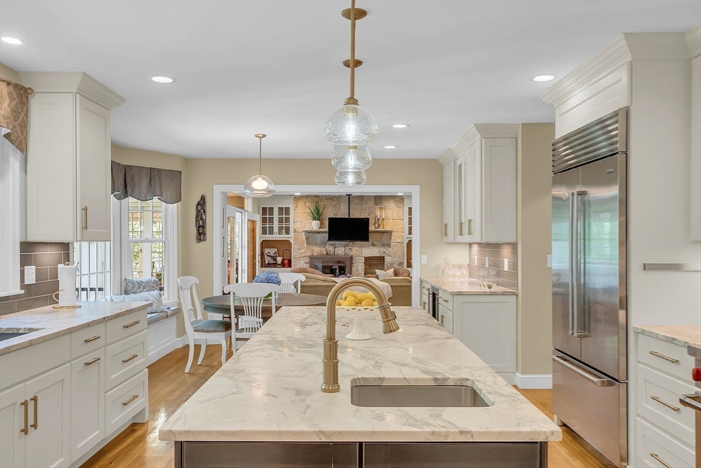 157 Lancaster Road North Andover, MA 01845 - Photo 10 of 42 a large kitchen with granite countertop a large counter top appliances and cabinets