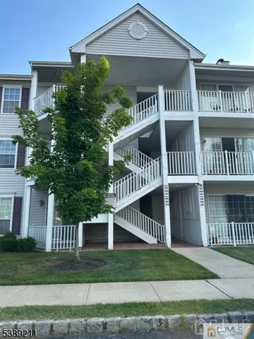a view of a house with a yard and plants