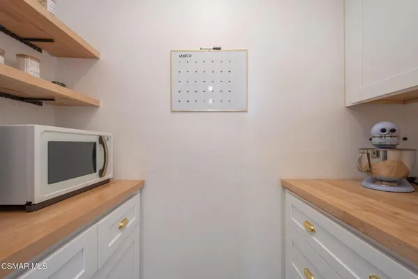 a view of storage and utility room with washer and dryer