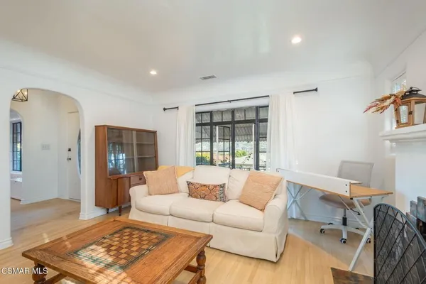 a living room with furniture and a rug