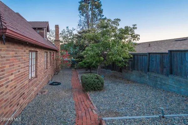 a view of a backyard with a house