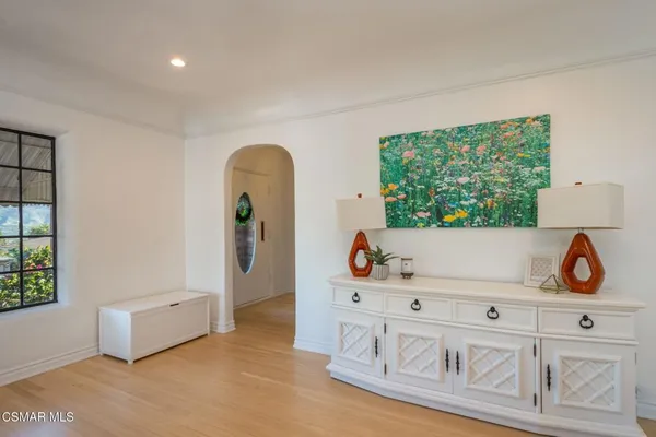 a view of a living room and entryway