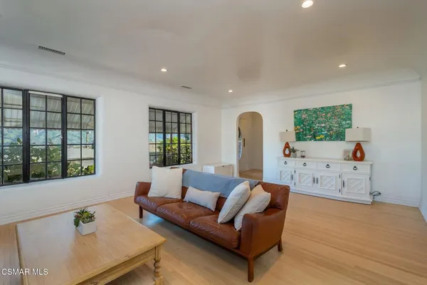 a living room with furniture and window