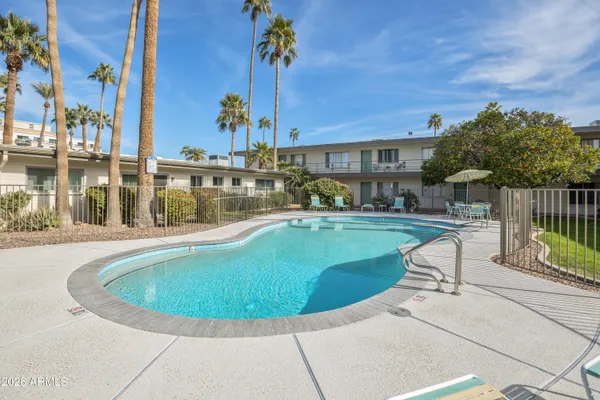 a view of a swimming pool with a patio