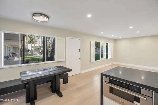 a view of a room with furniture and window