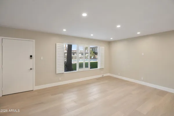 a view of an empty room with a window