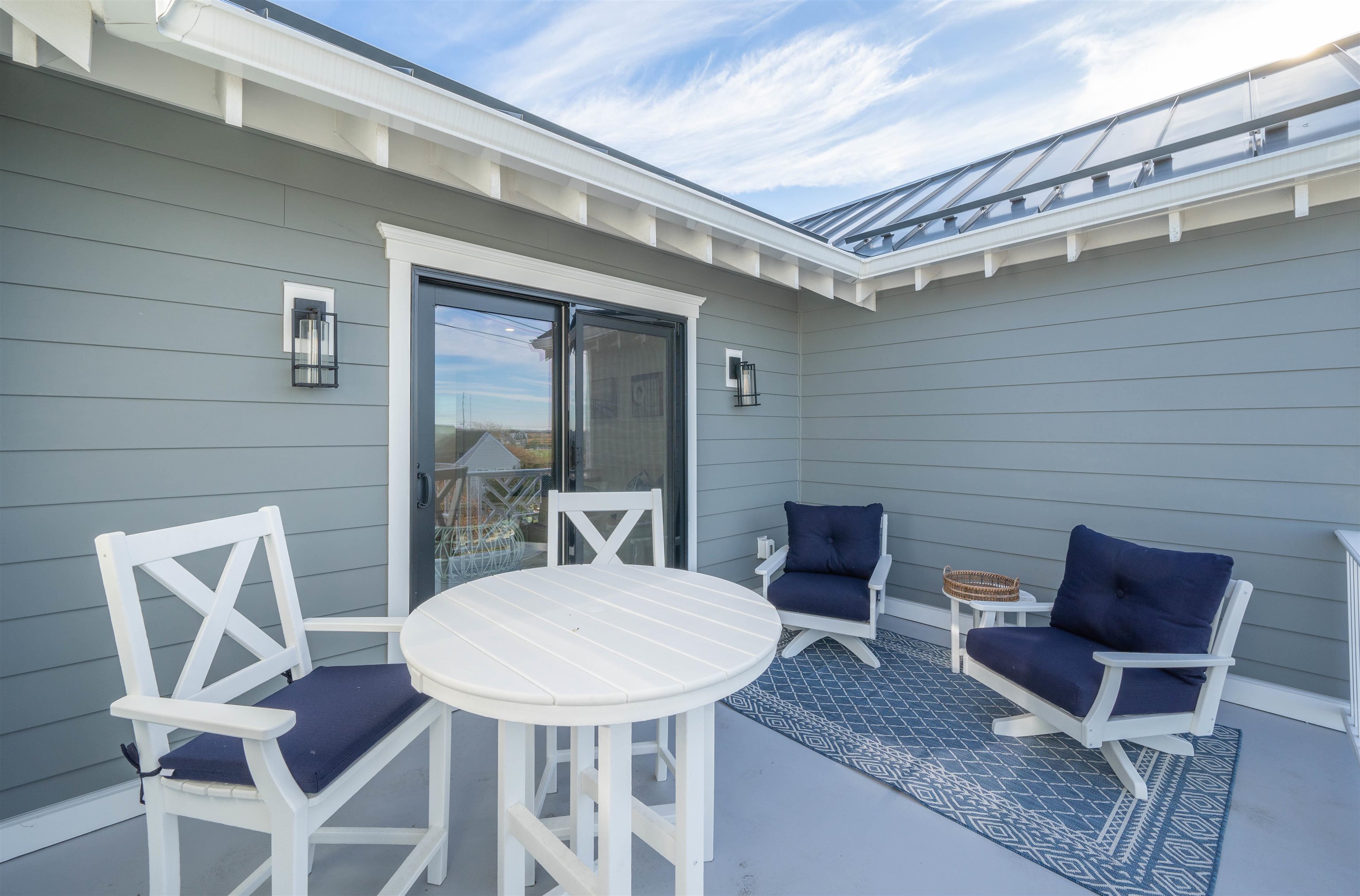 2927 Dune, Unit 1 Avalon, NJ 08202 - Photo 25 of 35 a outdoor space with a table and chairs