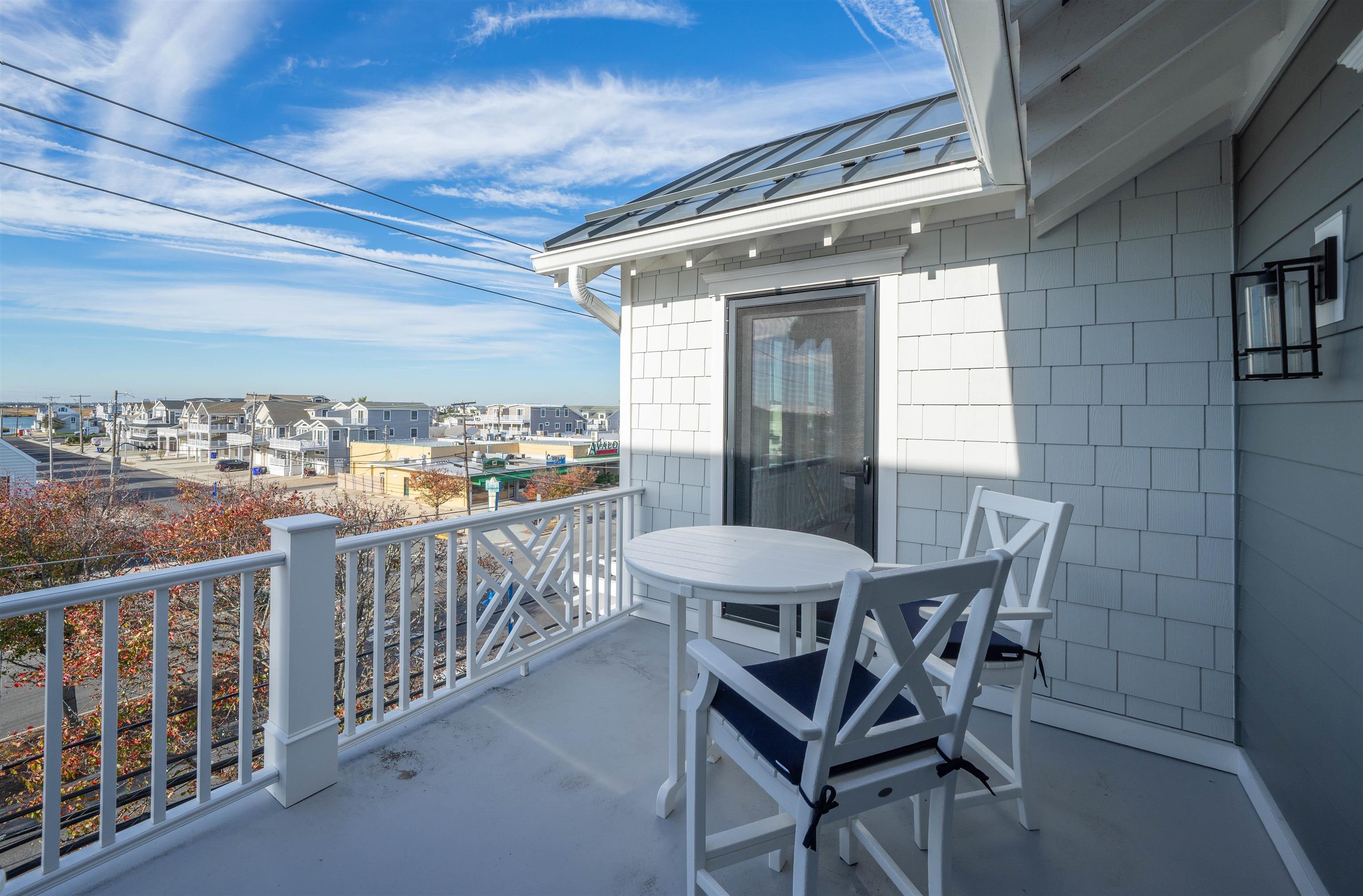2927 Dune, Unit 1 Avalon, NJ 08202 - Photo 27 of 35 a view of a chairs and table in the balcony