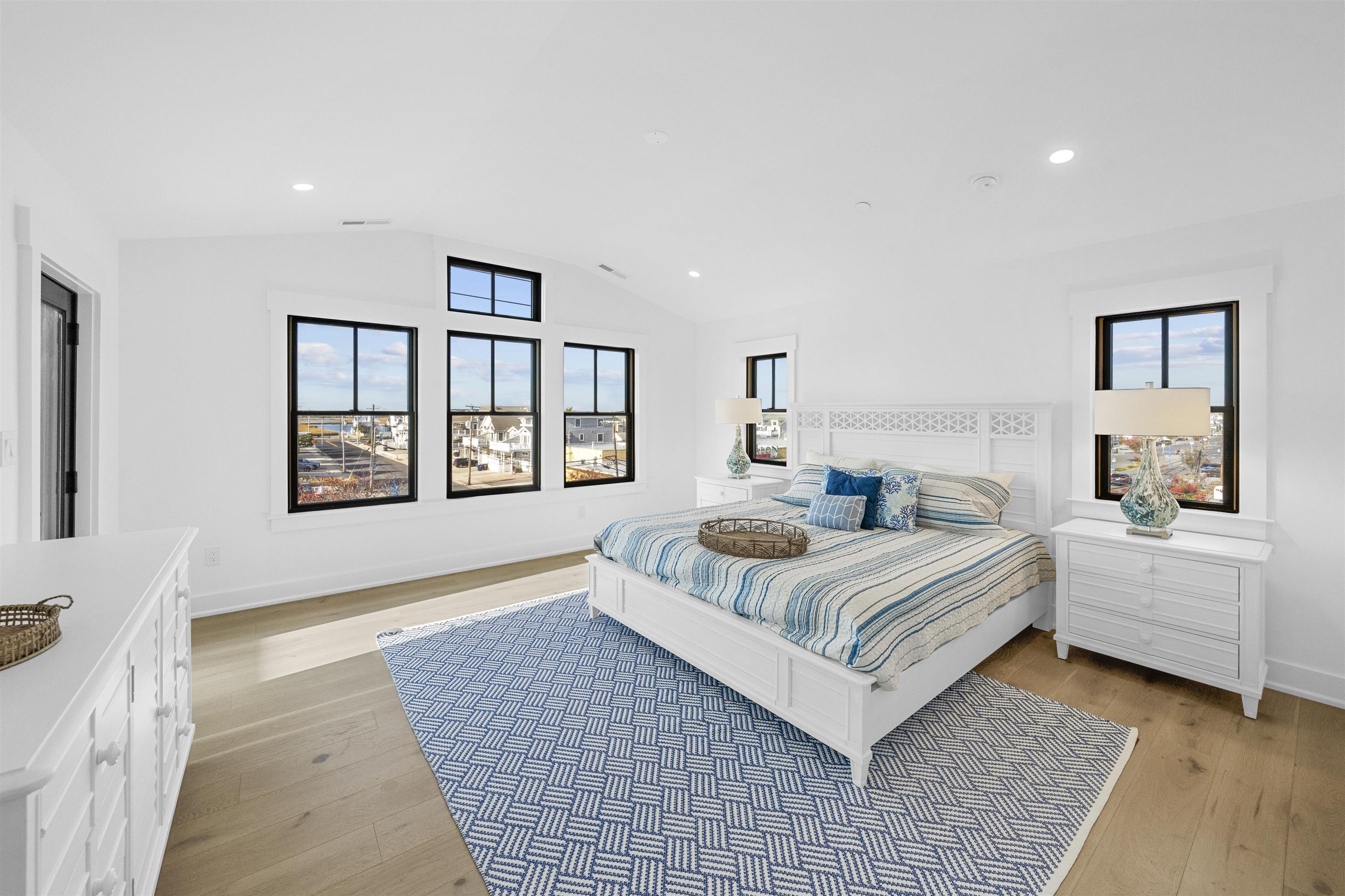 2927 Dune, Unit 1 Avalon, NJ 08202 - Photo 28 of 35 a bedroom with a large bed and a window