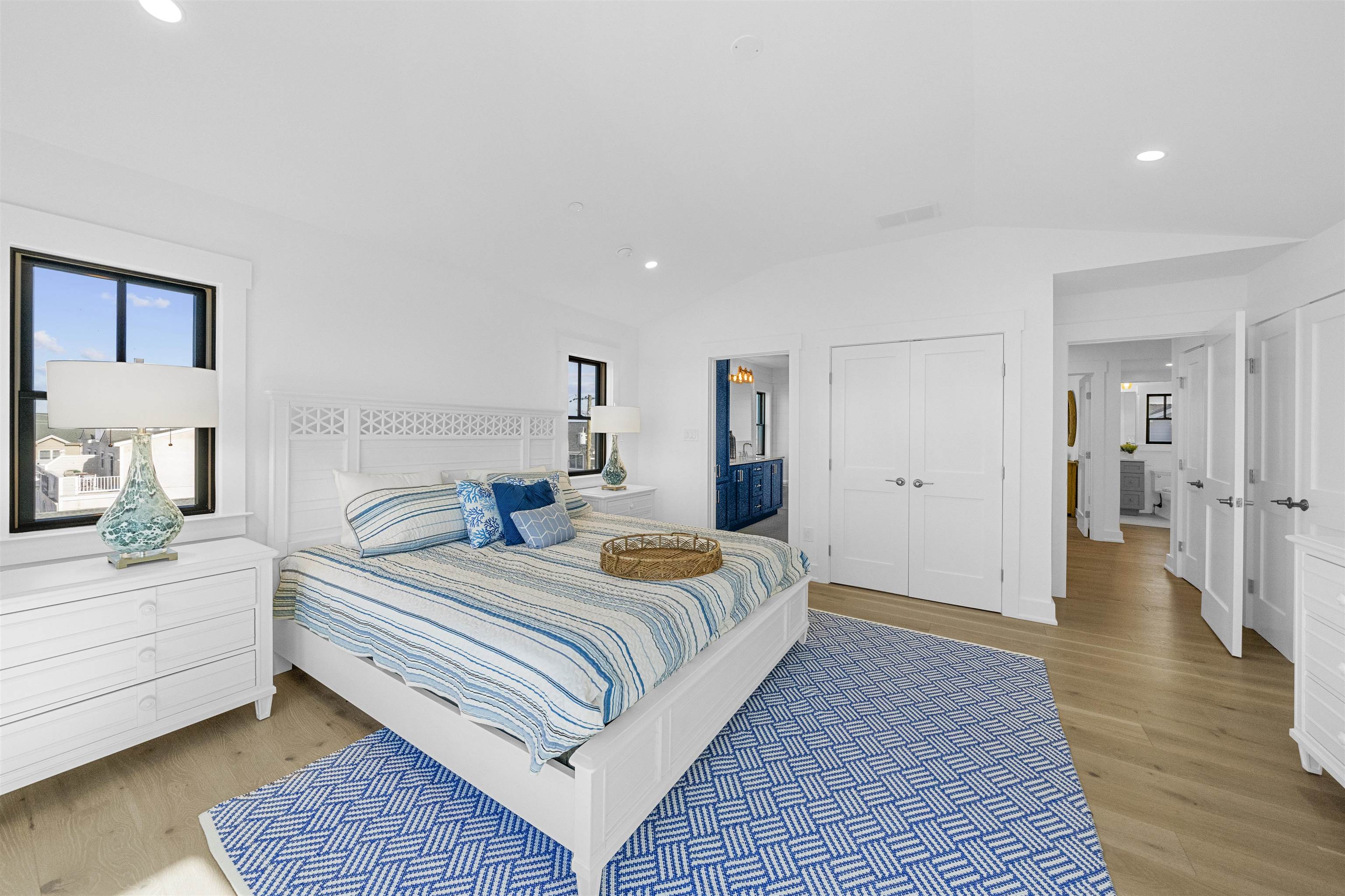 2927 Dune, Unit 1 Avalon, NJ 08202 - Photo 29 of 35 a bedroom with a bed and wooden floor