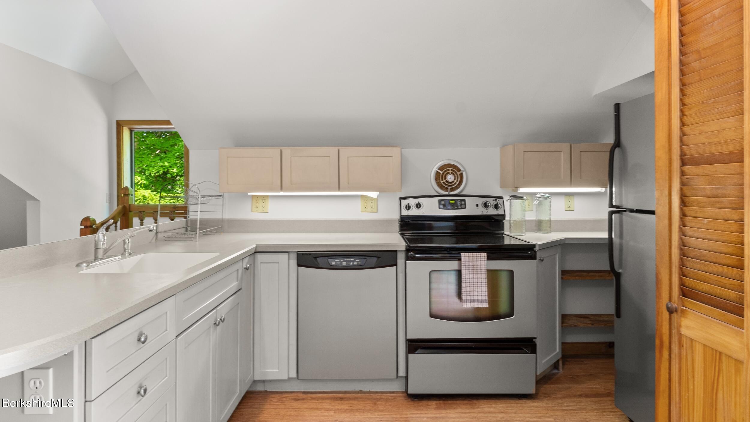 173 Hillsdale Road Egremont, MA 01230 - Photo 73 of 82 a kitchen with stainless steel appliances granite countertop a stove a sink and a refrigerator