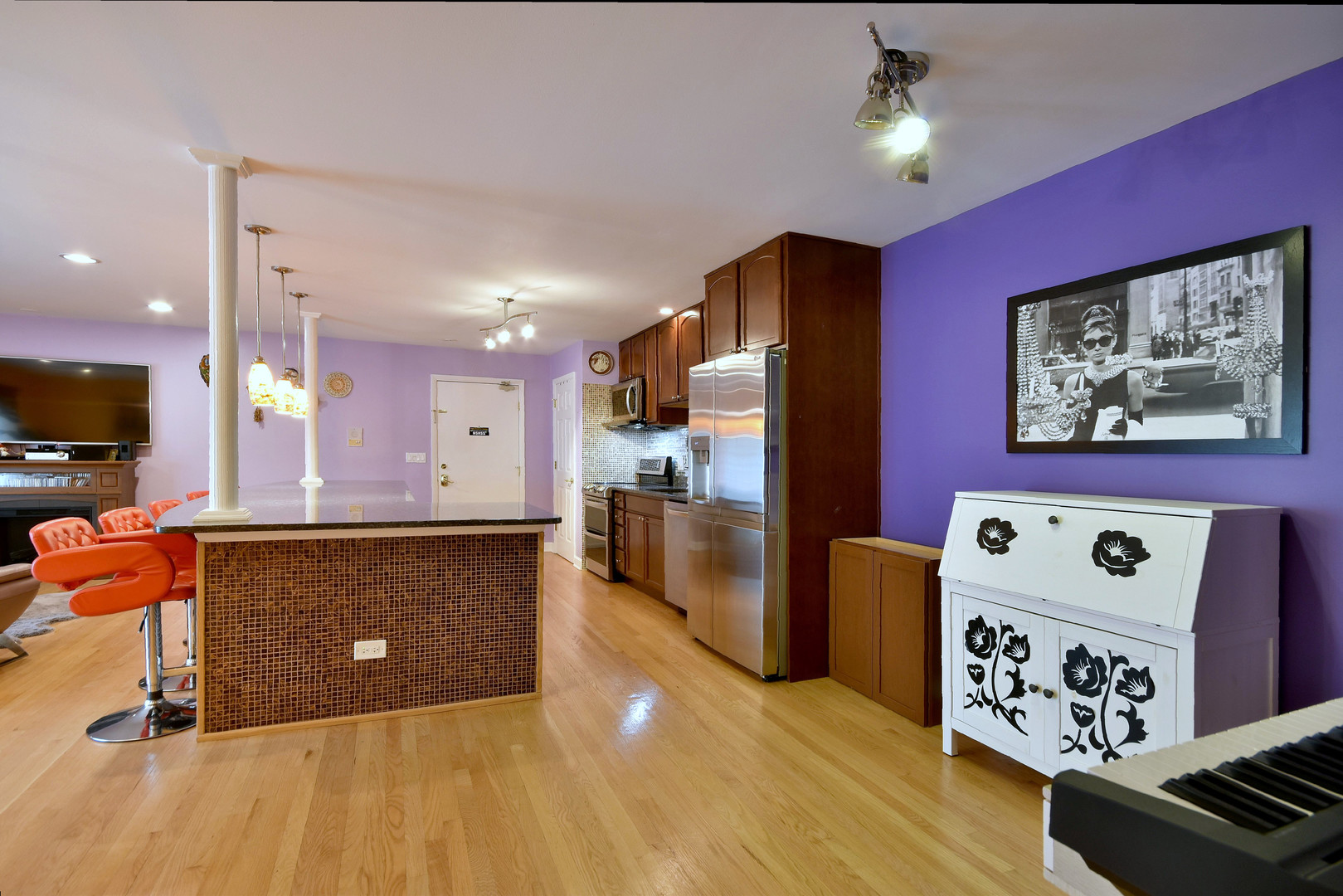 9601 Golf Road, Unit 303 Des Plaines, IL 60016 - Photo 14 of 38 a view of kitchen with stainless steel appliances granite countertop a refrigerator a oven a sink and a dining table with wooden floor