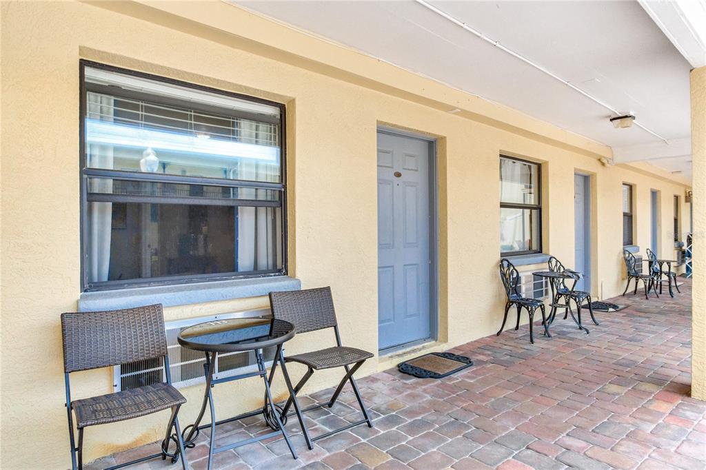 16333 Gulf Boulevard, Unit 113 Redington Beach, FL 33708 - Photo 33 of 40 a dining room with furniture and a window