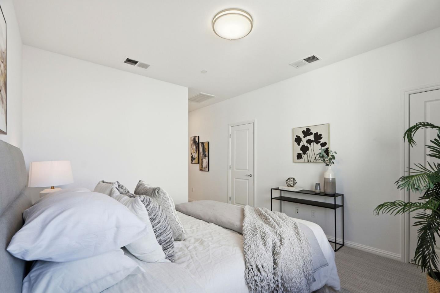 706 Fruit Ranch Loop San Jose, CA 95133 - Photo 20 of 39 a bedroom with a bed and a table