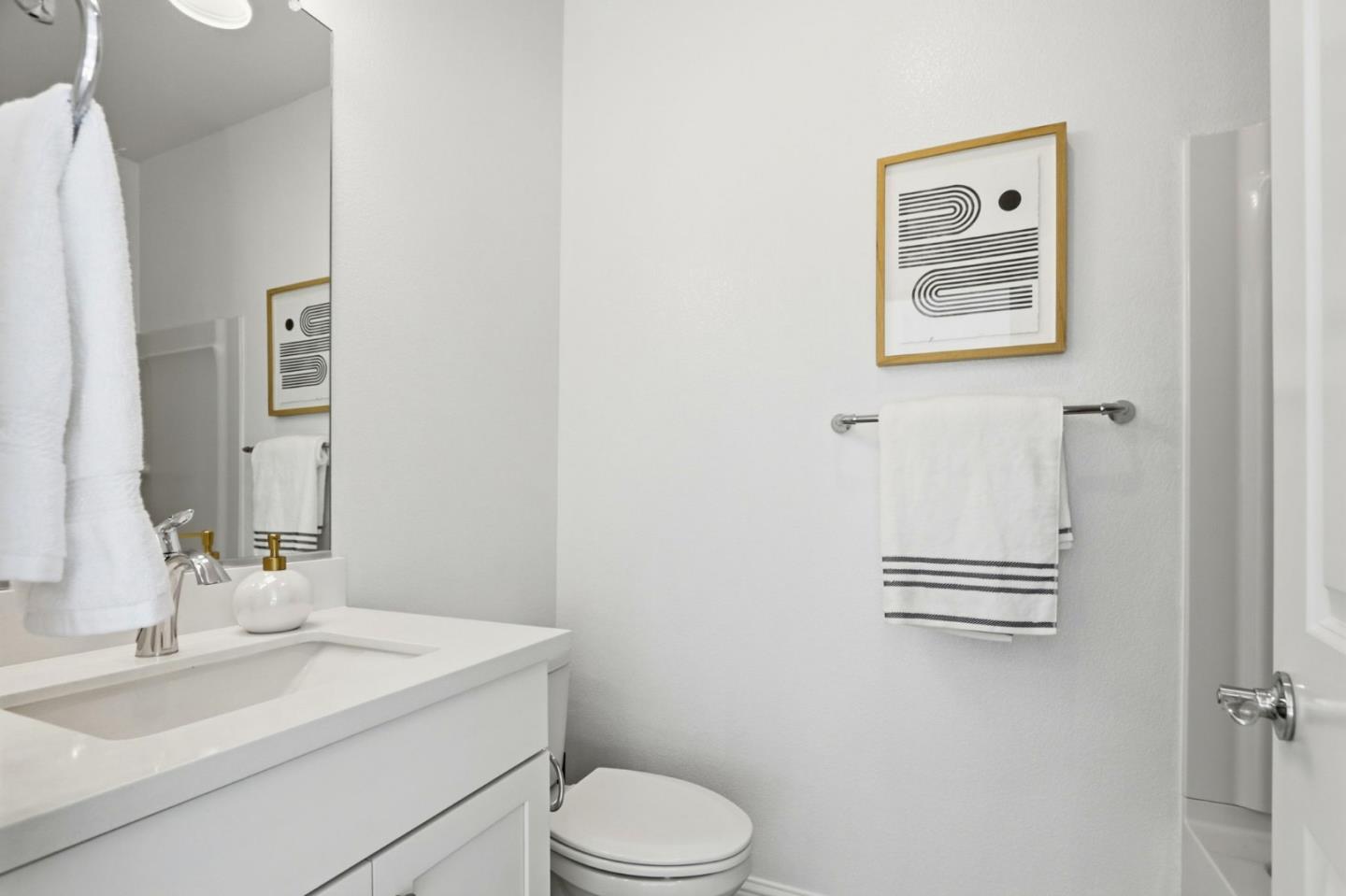 706 Fruit Ranch Loop San Jose, CA 95133 - Photo 24 of 39 a bathroom with a sink toilet and vanity