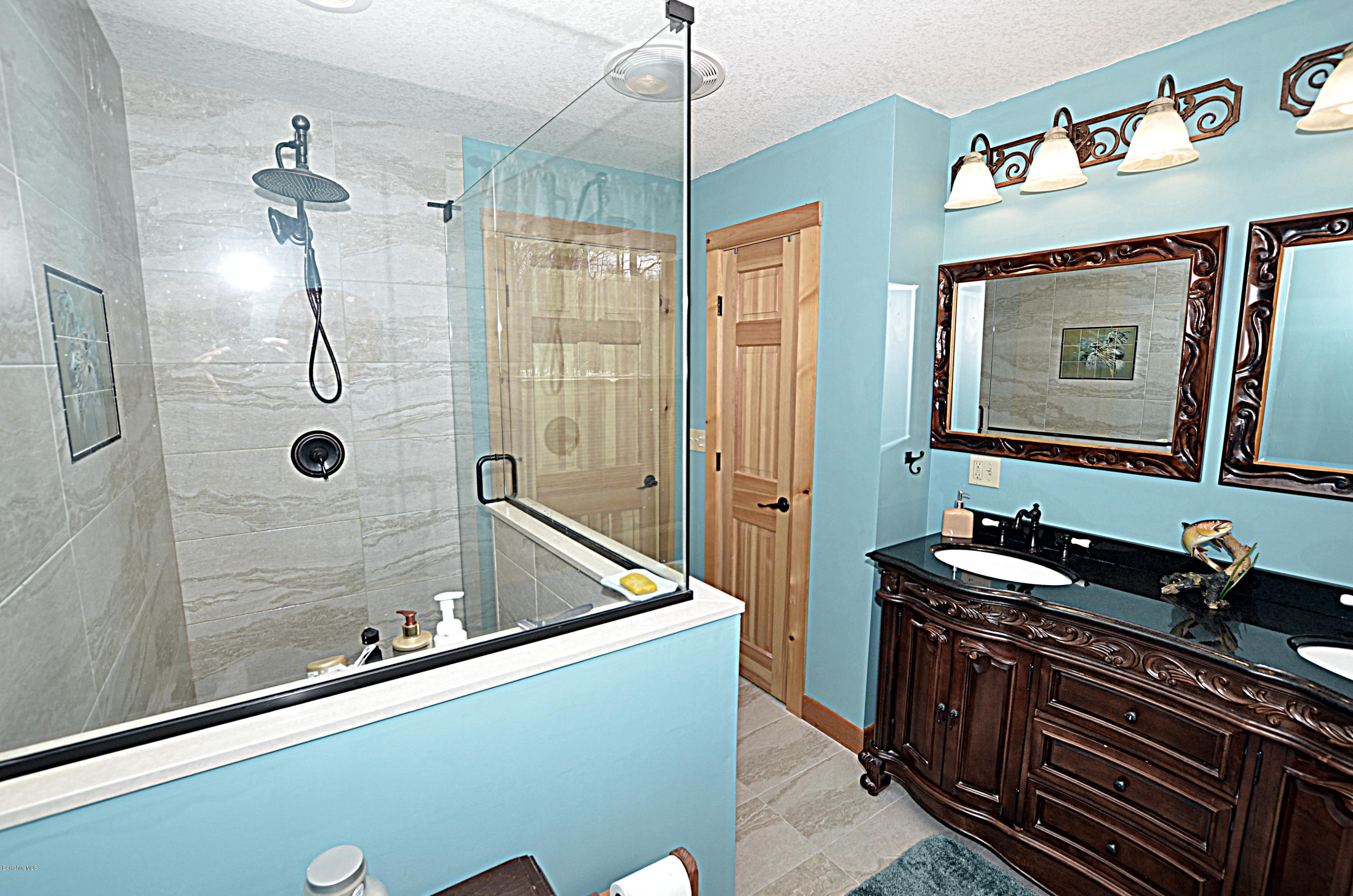 768 Stebbins Road Otis, MA 01253 - Photo 22 of 47 a bathroom with a sink and a mirror