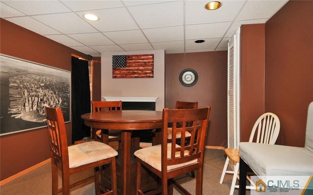 156 Tunison Road New Brunswick, NJ 08901 - Photo 14 of 25 a dining room with furniture and wooden floor