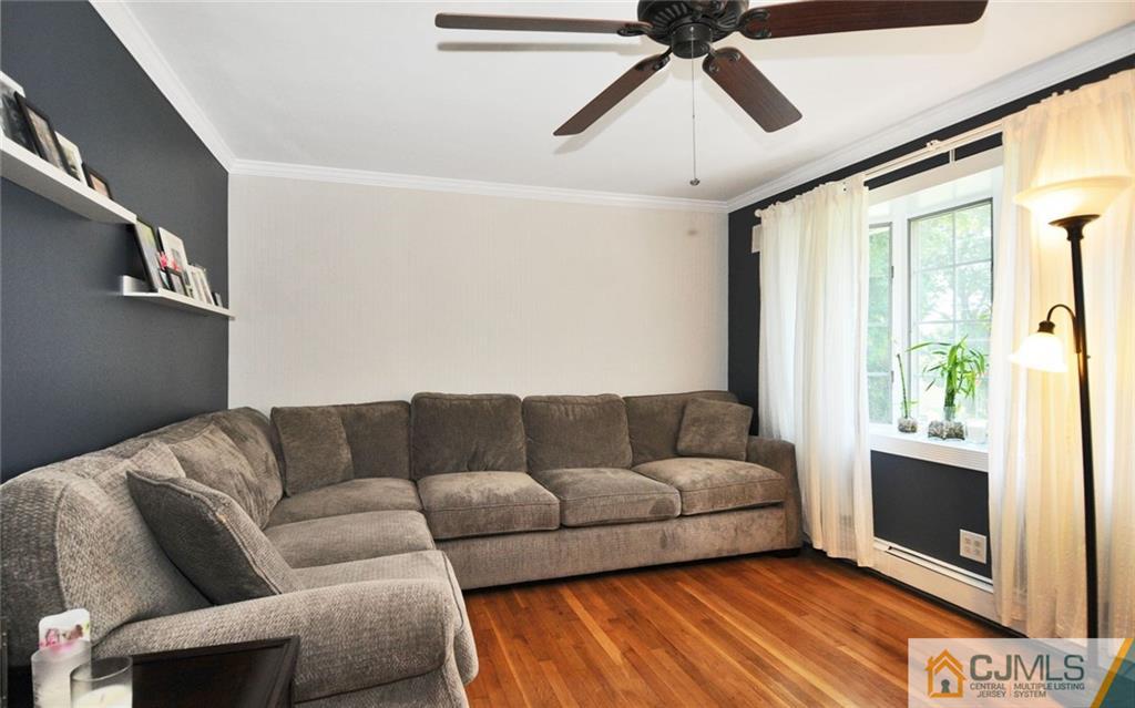 156 Tunison Road New Brunswick, NJ 08901 - Photo 3 of 25 a living room with furniture and a flat screen tv