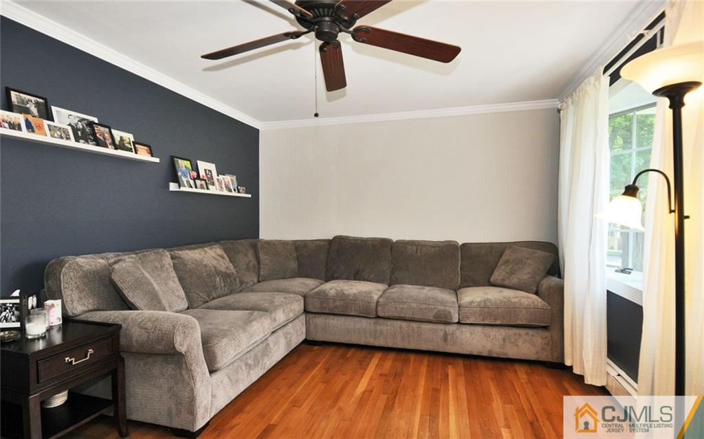 156 Tunison Road New Brunswick, NJ 08901 - Photo 4 of 25 a living room with furniture and a flat screen tv