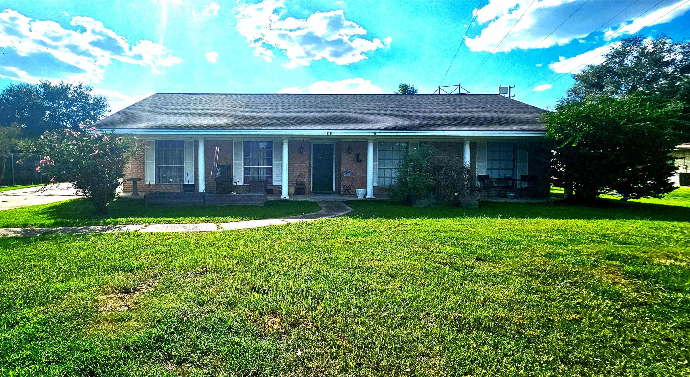 a view of a house with garden and yard