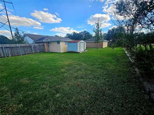 a view of a house with a back yard