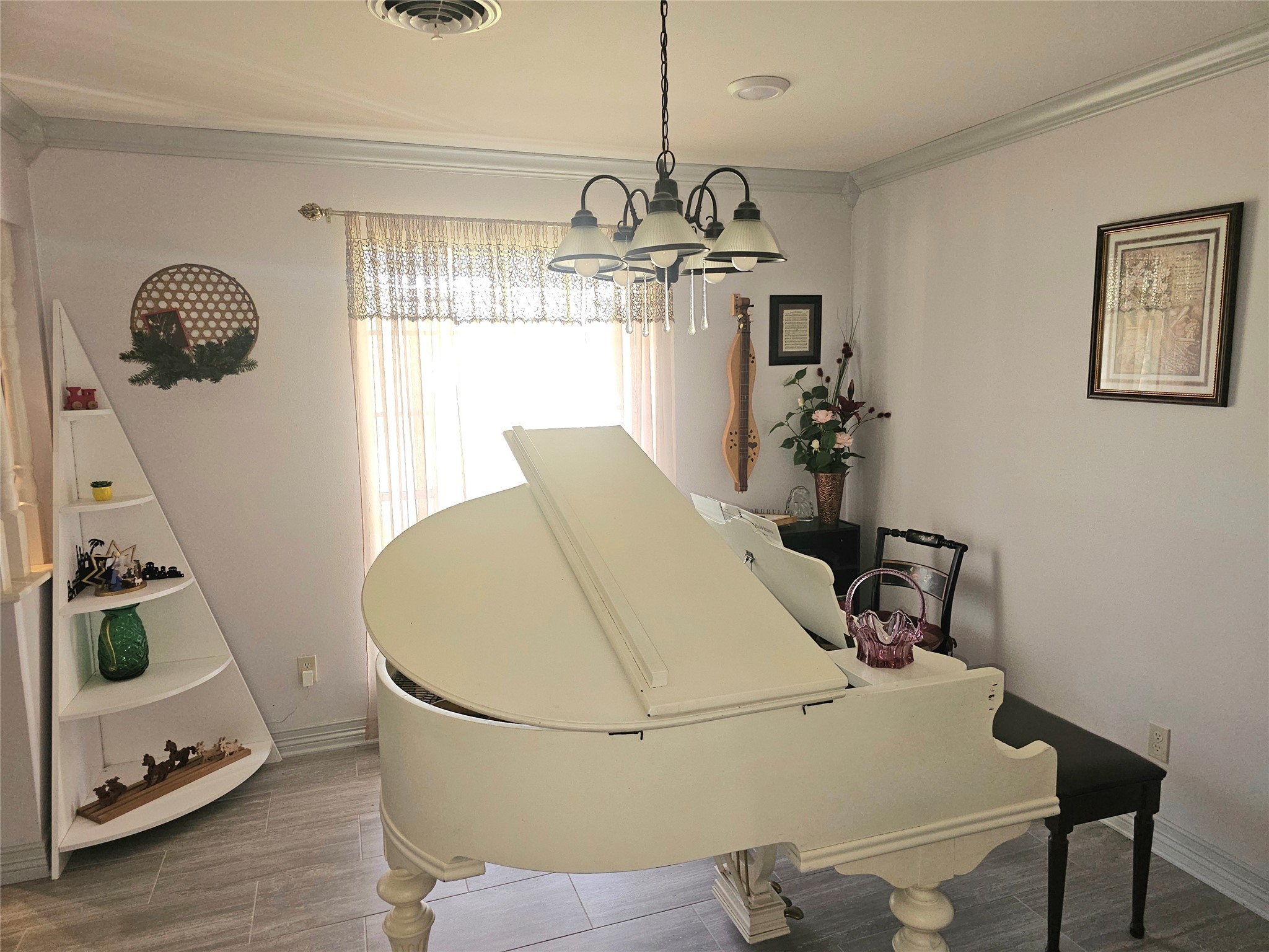 117 Laughlin Road Eagle Lake, TX 77434 - Photo 9 of 46 a view of a dining room with furniture and a chandelier