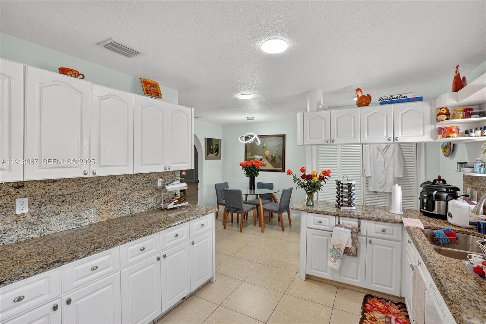 9835 Southwest 26th Terrace Miami, FL 33165 - Photo 14 of 48 a view of kitchen with counter top space cabinets and appliances