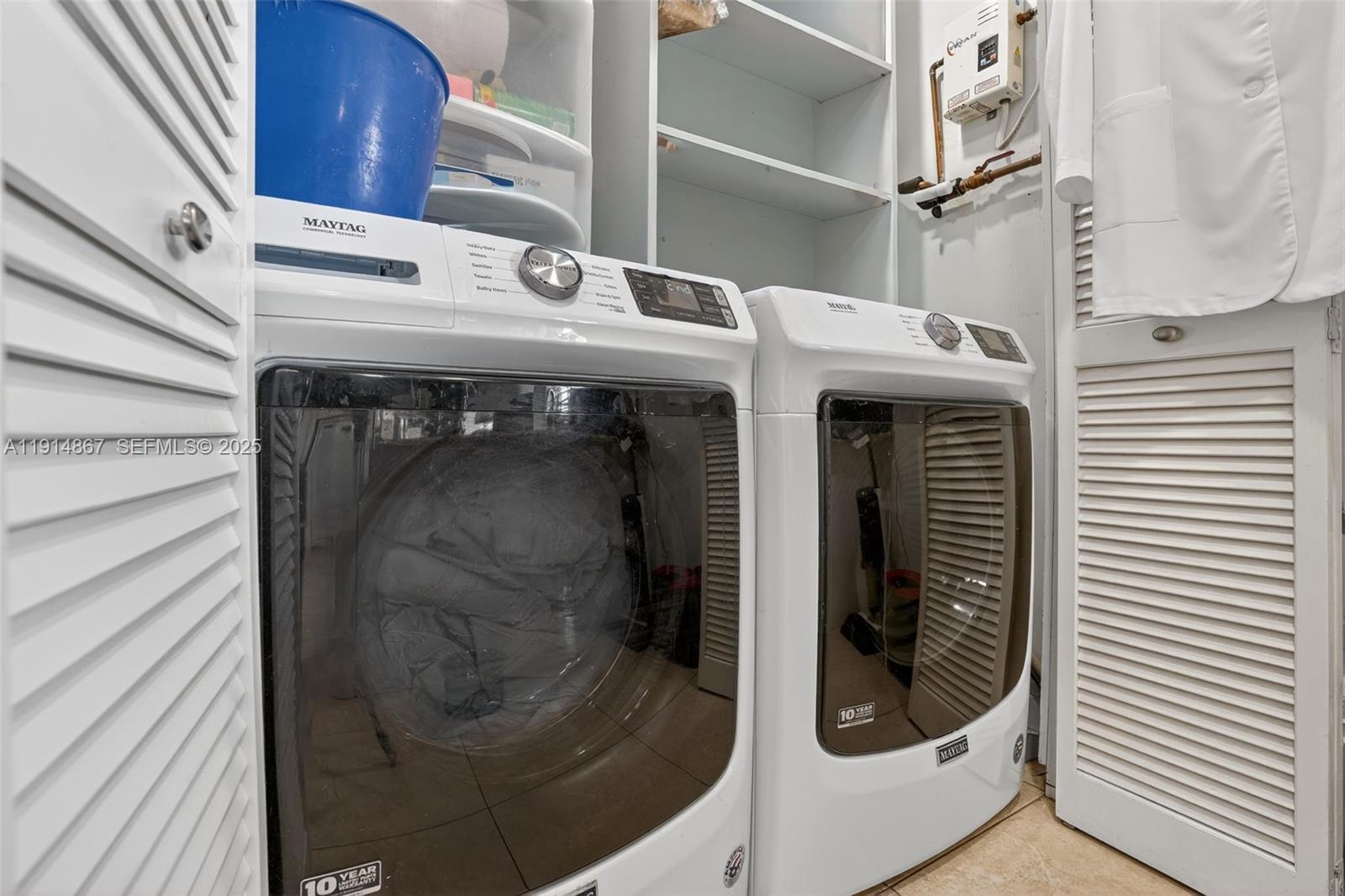 9835 Southwest 26th Terrace Miami, FL 33165 - Photo 15 of 48 a utility room with dryer and washer
