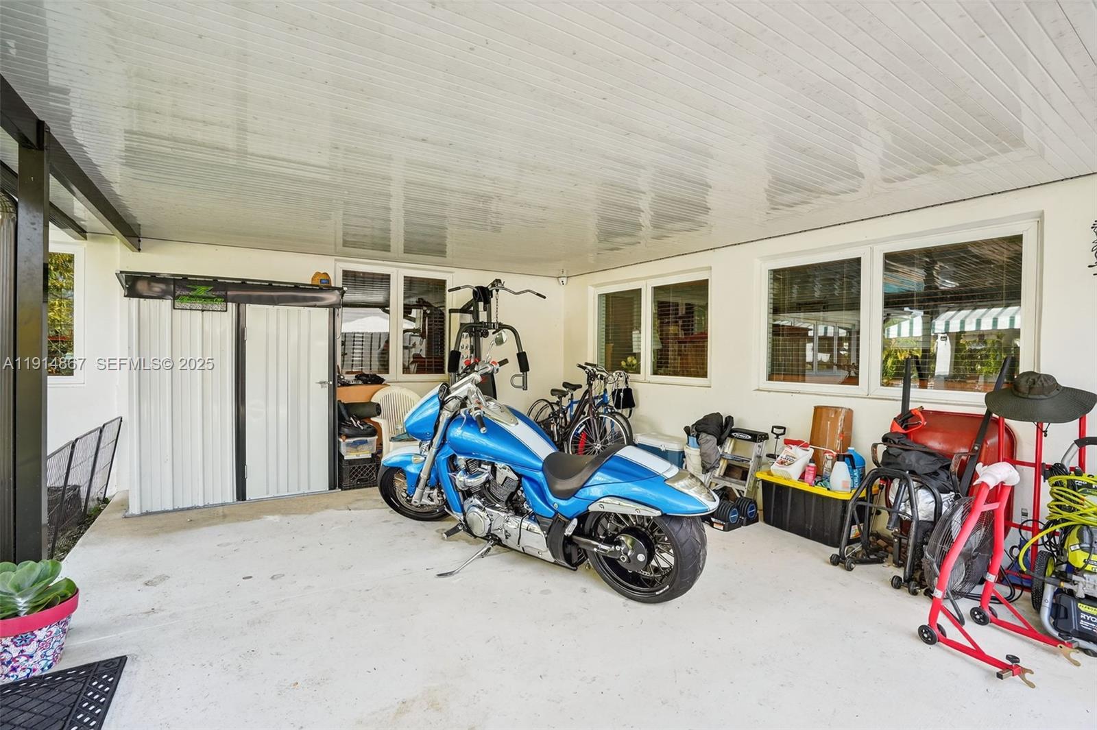 9835 Southwest 26th Terrace Miami, FL 33165 - Photo 26 of 48 a view of a garage with a bike and a bike