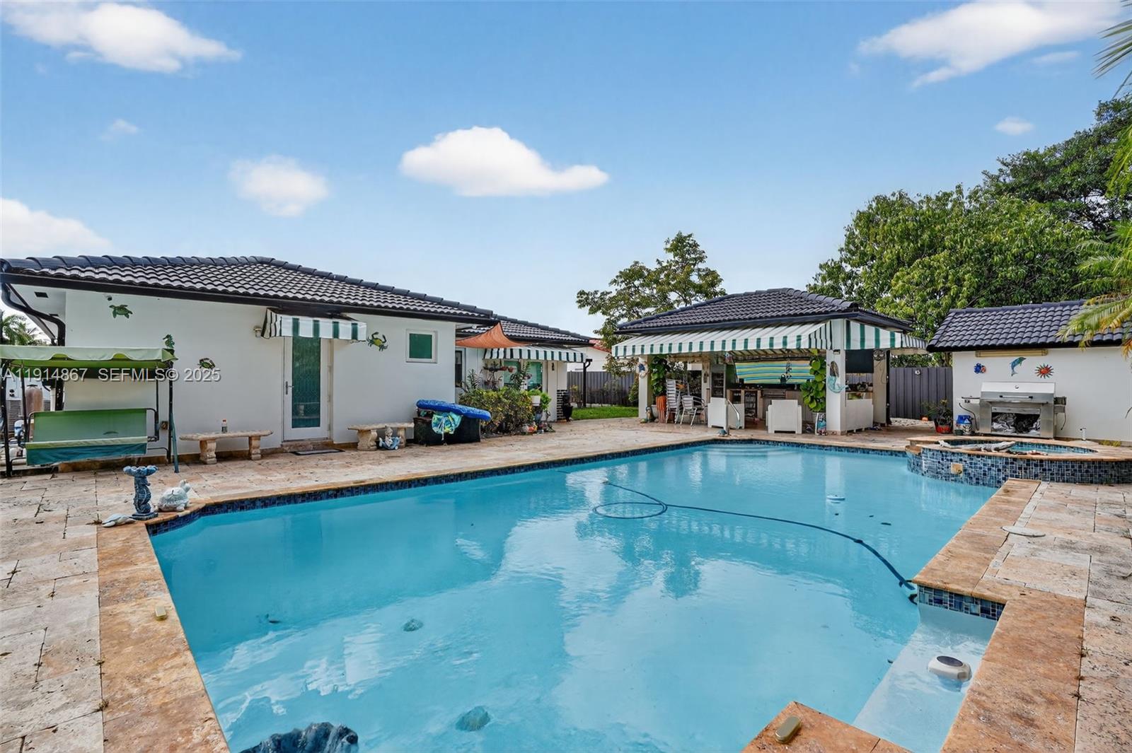 9835 Southwest 26th Terrace Miami, FL 33165 - Photo 36 of 48 a view of a house with swimming pool and sitting area