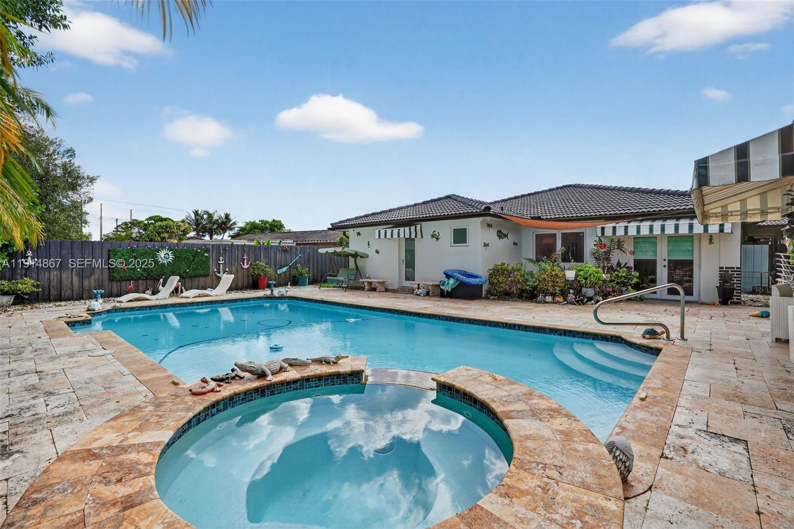 9835 Southwest 26th Terrace Miami, FL 33165 - Photo 37 of 48 a view of a swimming pool and lounge chair