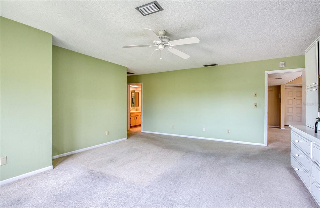 700 Starkey Road, Unit 1145 Largo, FL 33771 - Photo 25 of 63 an empty room with a ceiling fan and a window