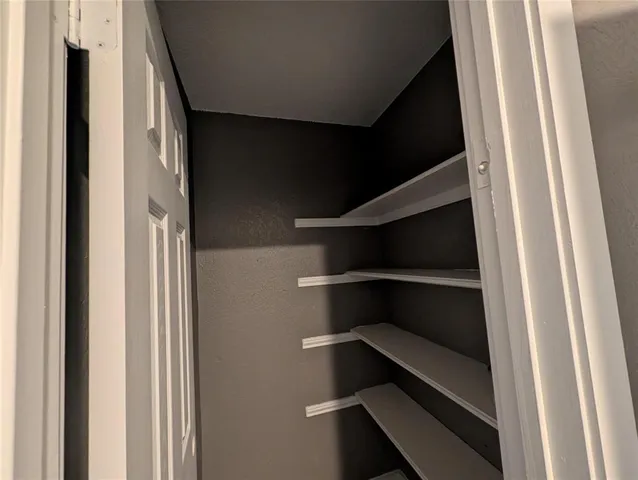 a view of an empty walk in closet