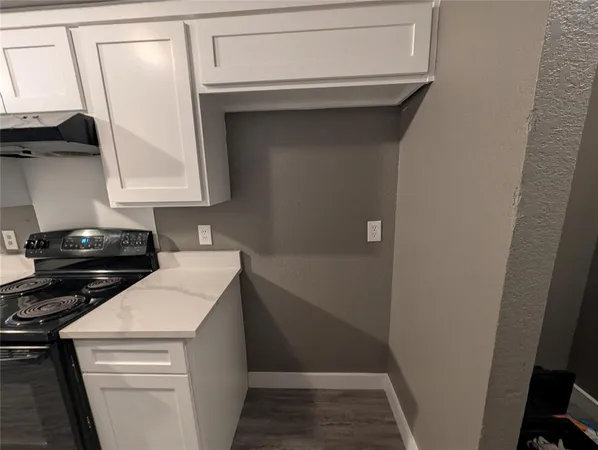 a utility room with sink dryer and washer