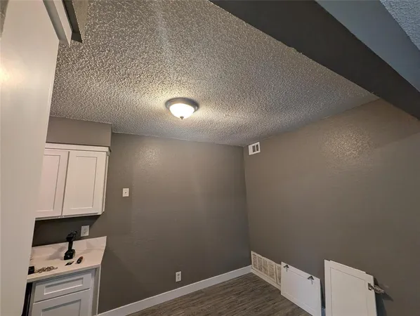 a view of storage and utility room with empty racks