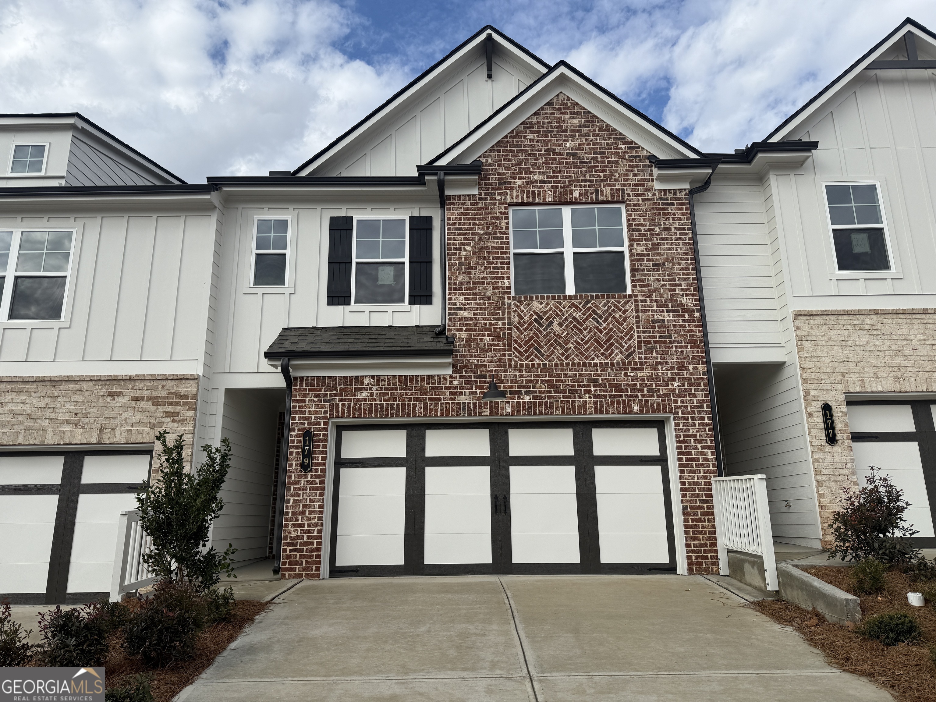 179 Depot Landing Road, Unit 27A Auburn, GA 30011 - Photo 1 of 1 a front view of a house with a yard and garage