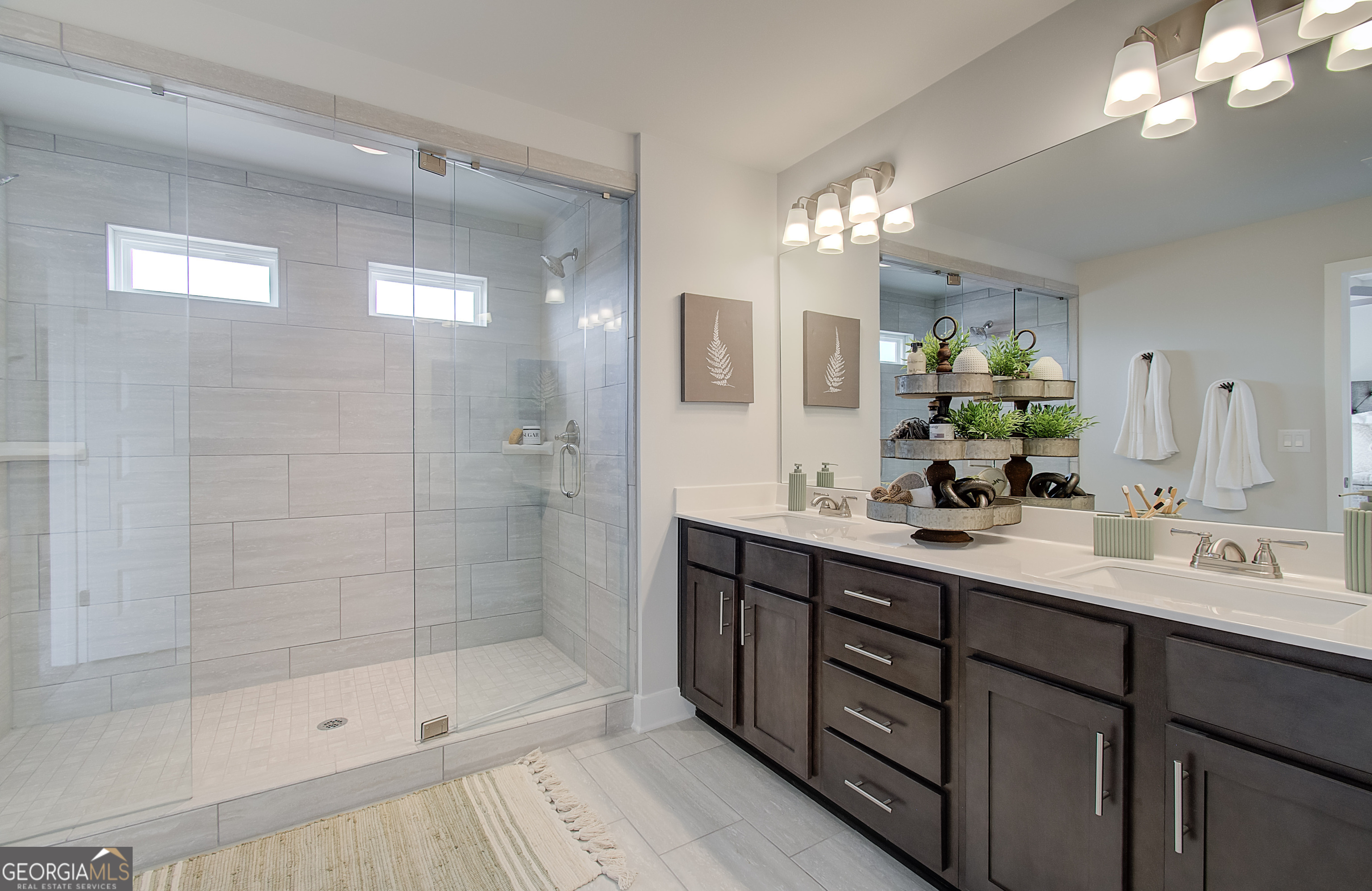 179 Depot Landing Road, Unit 27A Auburn, GA 30011 - Photo 19 of 38 a bathroom with a double vanity sink mirror and shower