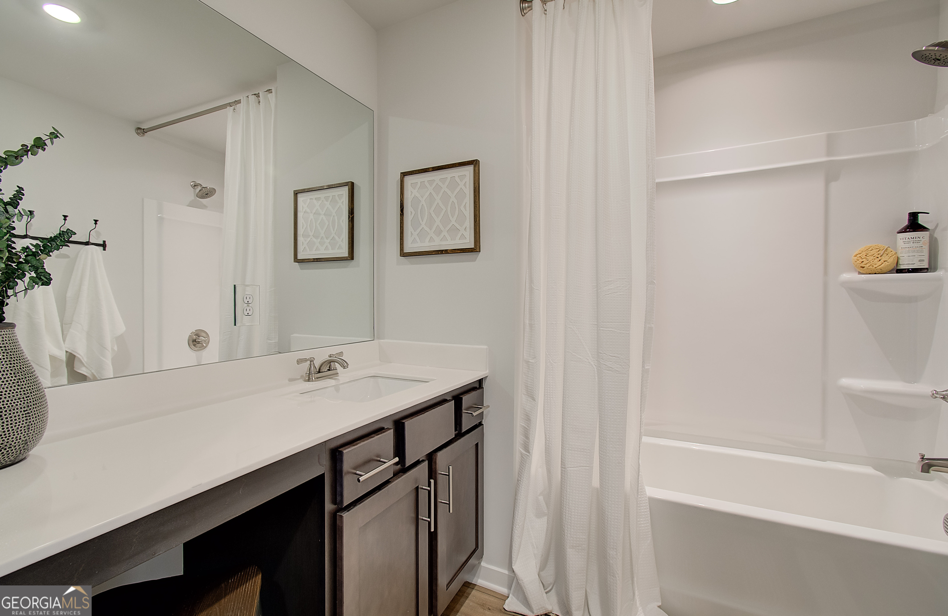 179 Depot Landing Road, Unit 27A Auburn, GA 30011 - Photo 23 of 38 a bathroom with a sink and a mirror