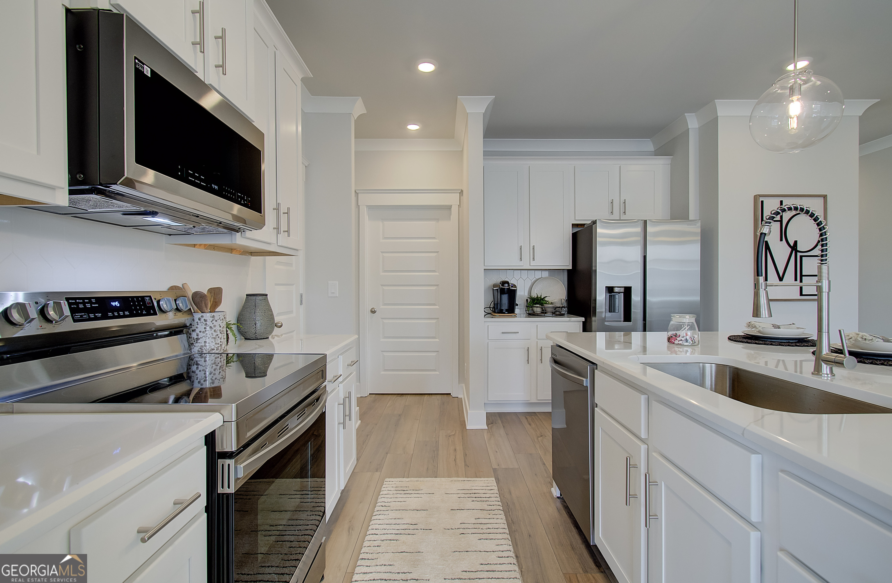 179 Depot Landing Road, Unit 27A Auburn, GA 30011 - Photo 6 of 38 a kitchen with a sink and steel appliances