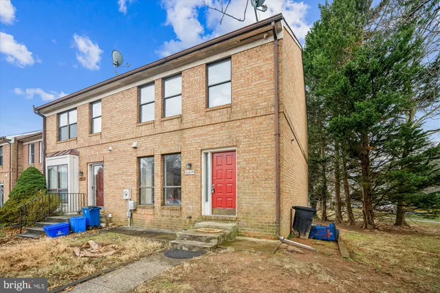 a view of a backyard with sitting area