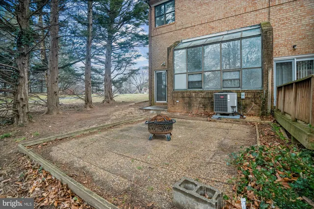 a kitchen with refrigerator and cabinets