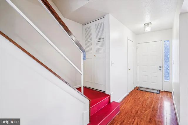 a kitchen with a white stove top oven and refrigerator