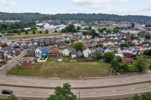 an aerial view of a town with couple of houses