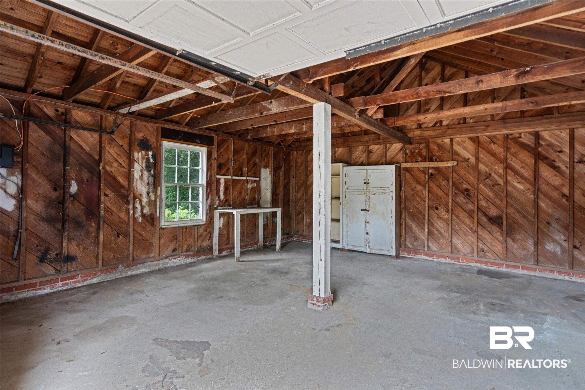 300 Woodlands Avenue Mobile, AL 36607 - Photo 18 of 23 Garage with wood walls