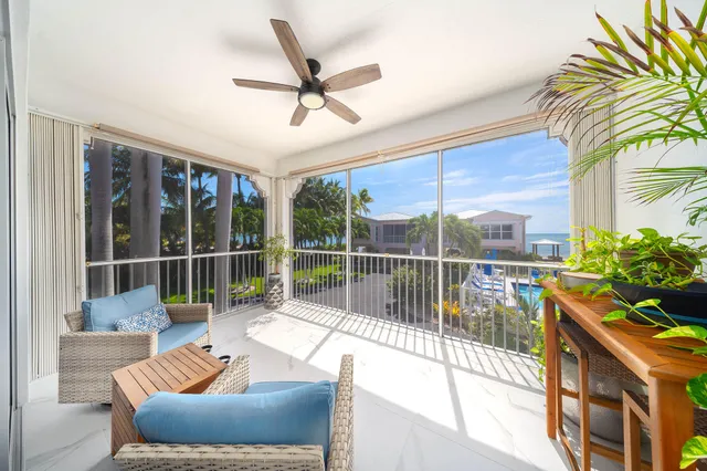 a bedroom with bed and a large window