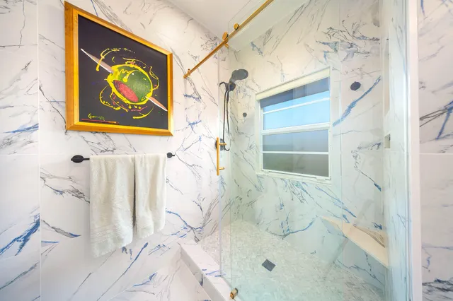 an aerial view of a house with swimming pool