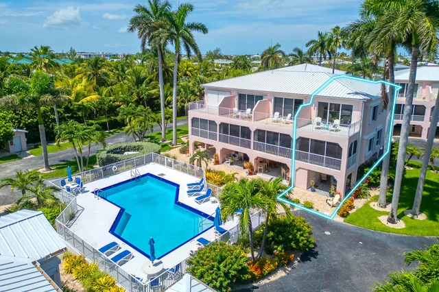an aerial view of a house with outdoor space